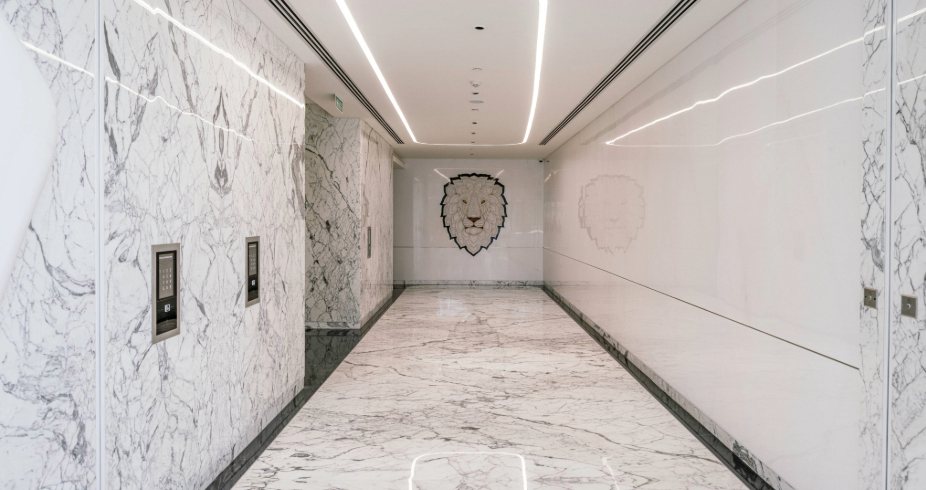 Marble corridor in the AIPL Masterpiece lobby in Gurugram
