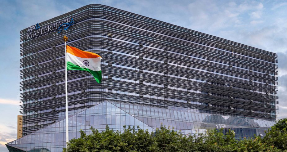AIPL Masterpiece building on Golf Course Road in Gurugram under a blue sky