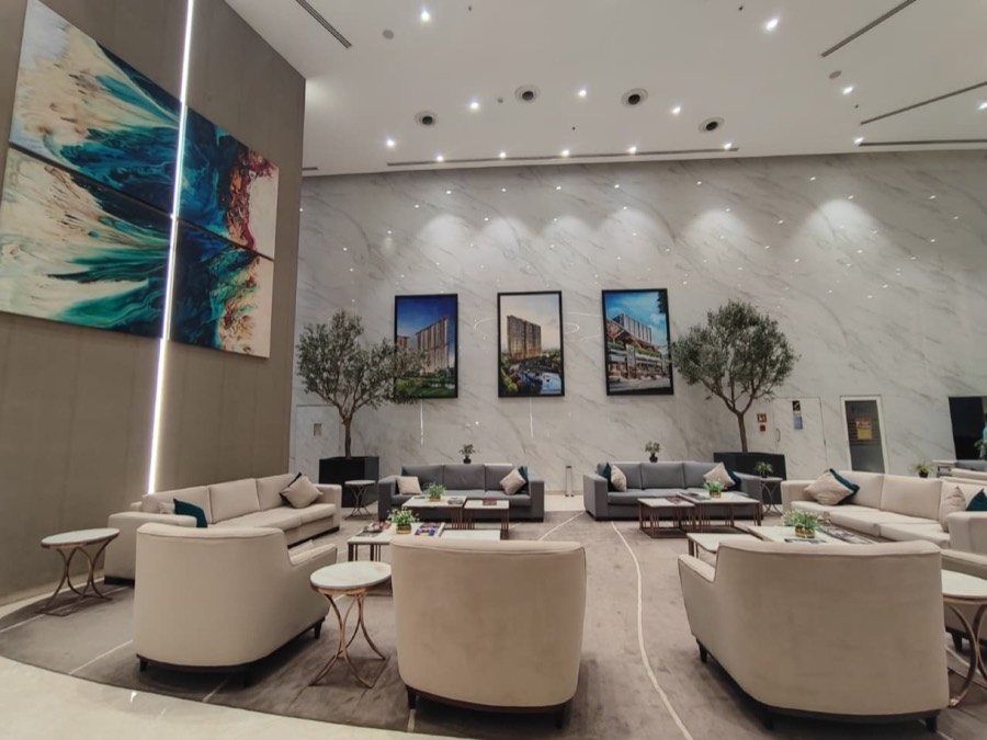 M3M IFC lobby lounge with marble walls, artwork and plush seating